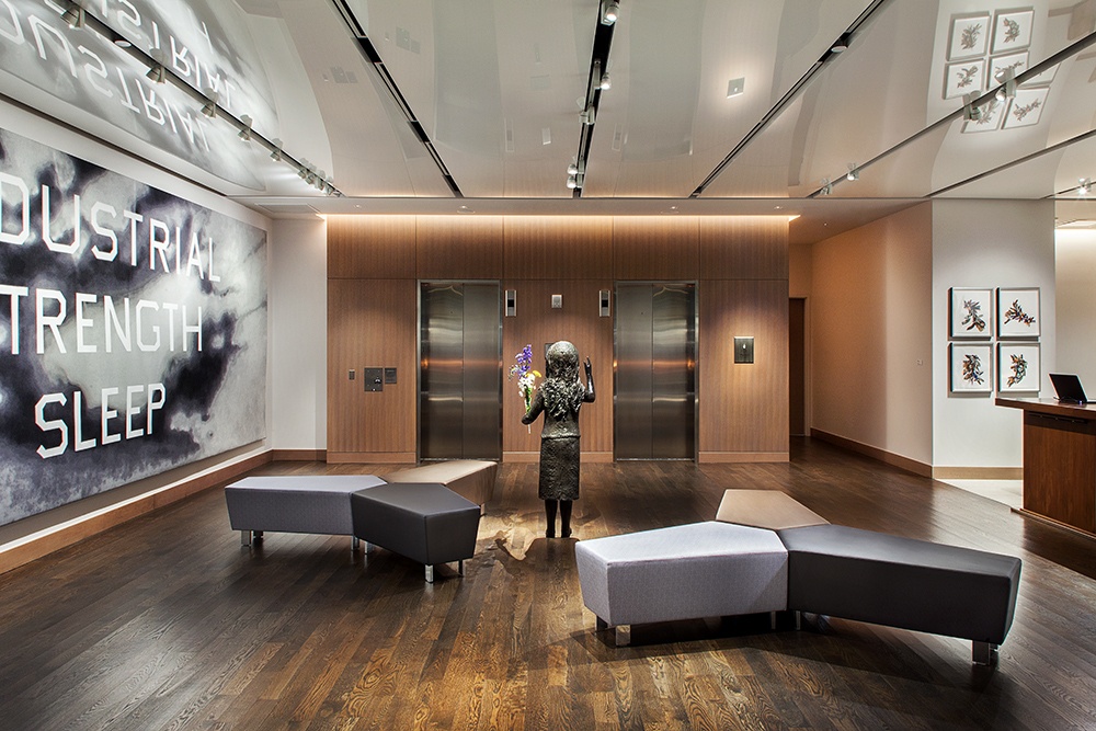 The image on the bottom shows a lobby space with track lighting system installed. Track Lighting Systems in a Lobby Lighting Application (Bottom) The image on the bottom shows a lobby space with track lighting system installed. Track Lighting Systems in a Lobby Lighting Application (Bottom)